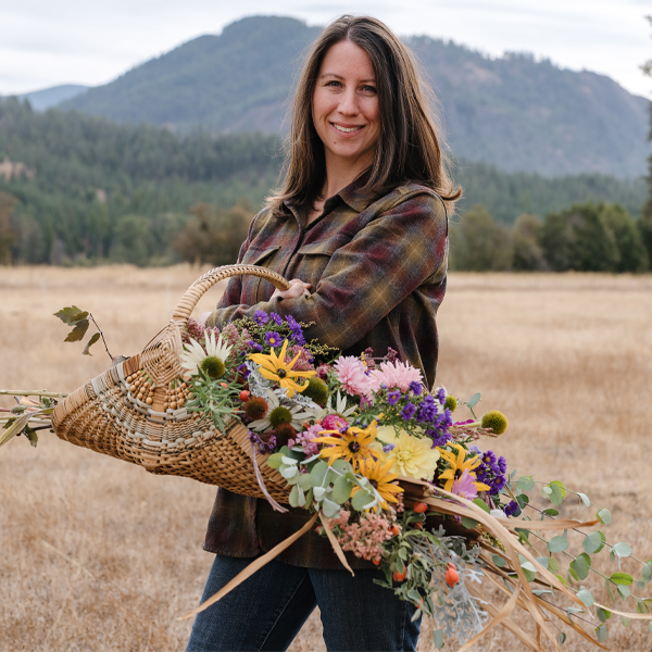 Abigail Belliveau with am armload of colorful blooms