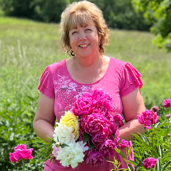 Carol L deSousa holding a bouquet